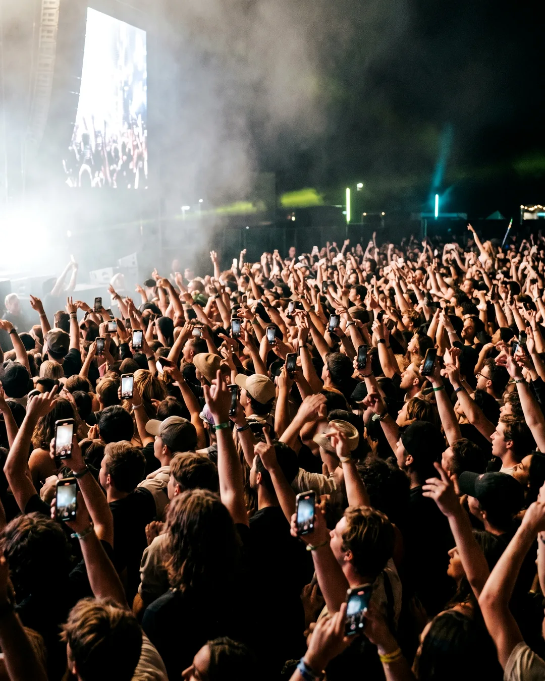 A high-key, brightly lit crowd at a night event